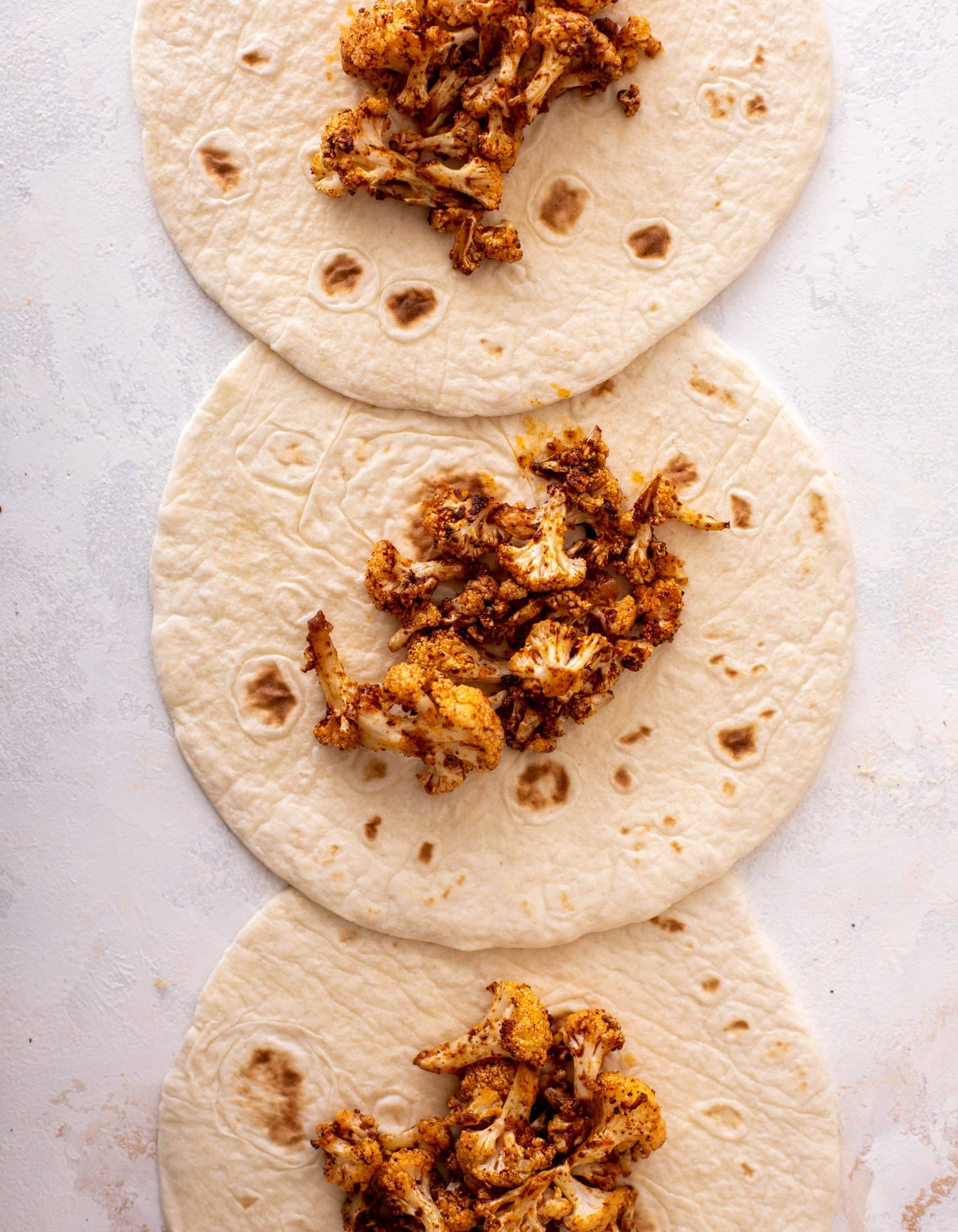 chipotle cheddar cauliflower enchiladas