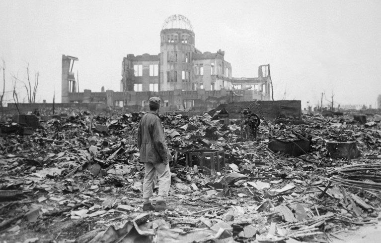 Man from his back looking at the wrecked framework of the Museum of Science and Industry as it appeared shortly after the blast.