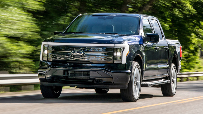 The Ford F-150 Lightning seen in front three-quarter view while driving