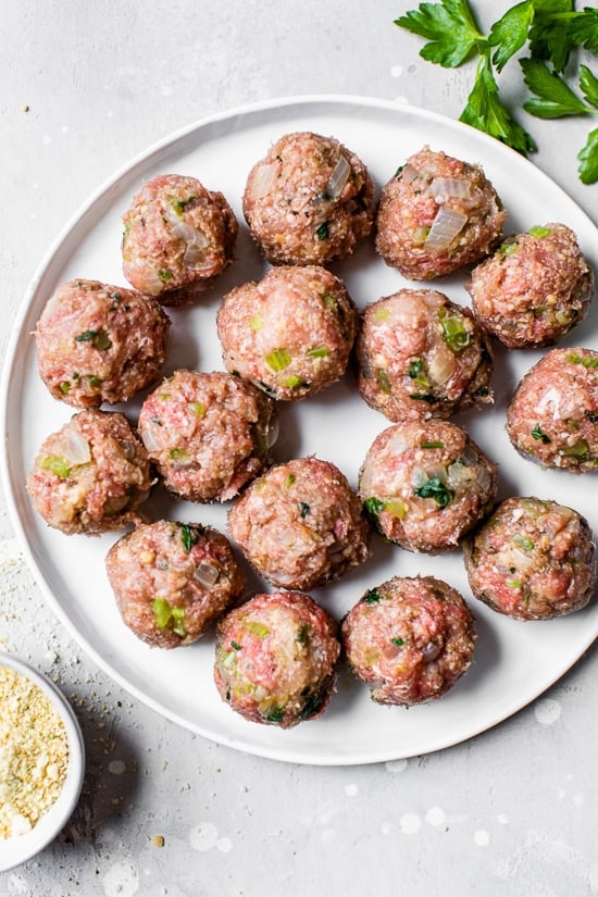 These easy Swedish meatballs are a lighter version of the classic, but they have the same cozy, comforting flavor and creaminess you love! Meatballs on a plate before cooking.