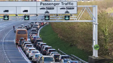 PA Media Passengers queue to enter the Channel Tunnel site in Folkestone in Kent