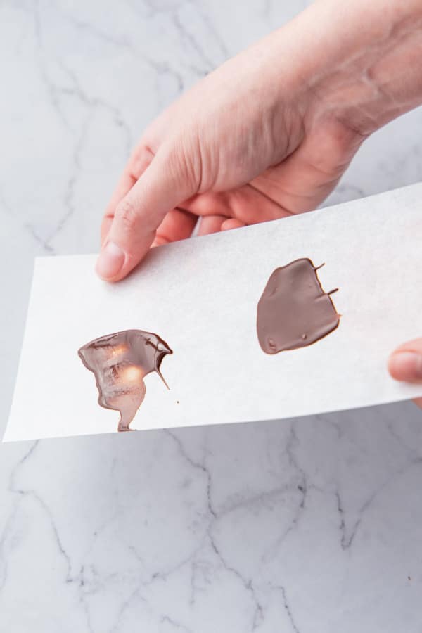 Properly tempered chocolate (right) is snappy and set, while untempered chocolate (left) still liquid.